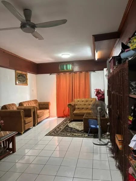 Living features: 3-seater fabric sofa in brown, 2-seater fabric sofa in brown, armchair in brown, coffee table, area rug with geometric pattern, white tiled flooring, wooden wall paneling, ceiling fan, curtains in orange, wall-mounted artwork, decorative plants, floor lamp; style: traditional.