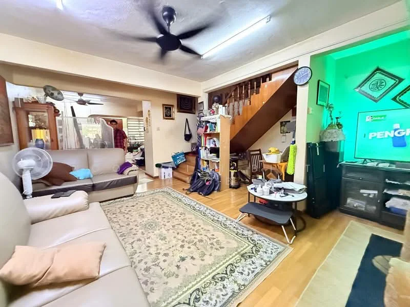 Living features: 3-seater leather sofa in beige, area rug with floral pattern, coffee table, wall-mounted TV, TV console, ceiling fan, wooden flooring, decorative wall art, open staircase, bookshelves, decorative mirror, light green accent wall; style: contemporary. Room features: wooden staircase, open space leading to another room, additional furniture visible.