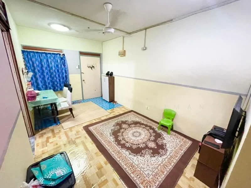 Room features: wooden flooring, cream painted walls, blue curtains, ceiling fan, area rug with intricate pattern, small green chair, desk with chair, wall-mounted TV, door, window, storage cabinet; style: minimalist.