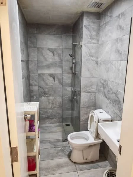 Bathroom features: grey marble tile flooring, grey marble tile walls, walk-in shower with glass enclosure, chrome handheld shower, toilet, single-sink vanity with white cabinet, mirror above sink, shelf unit for toiletries; style: modern.