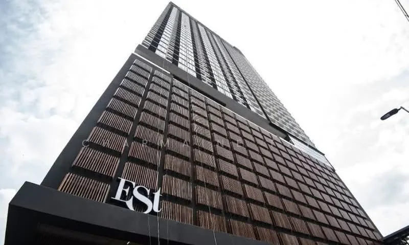 Exterior type: high-rise condominium; features: glass curtain wall, exposed concrete facade, timber cladding, recessed balconies, feature lighting at night; style: modern.