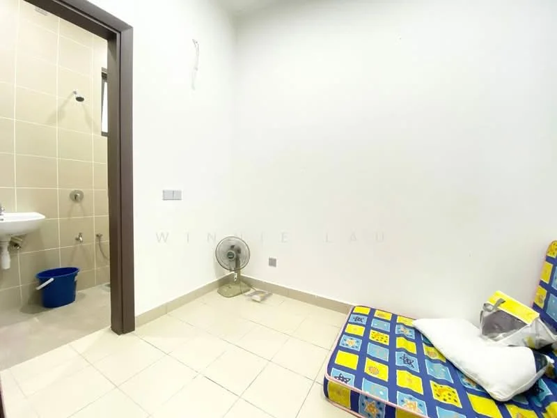 Room features: white painted walls, cream tiled flooring, single ceiling light, wall-mounted fan, small window, sink with faucet, shower fixture, blue plastic bucket, foldable chair with colorful pattern.