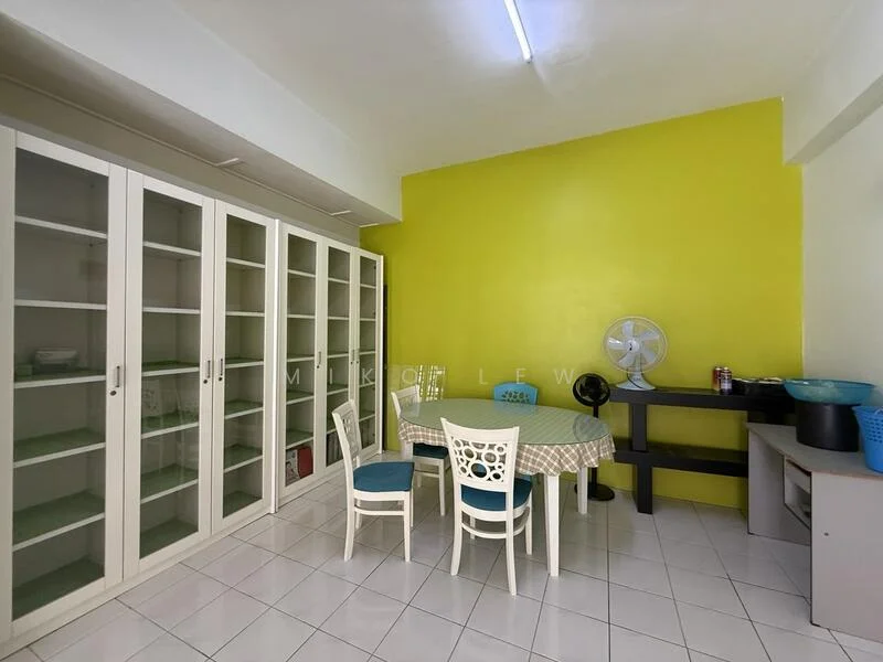 Dining features: white tiled flooring, green accent wall, round dining table with checkered tablecloth, 4 white dining chairs, glass-front cabinets, ceiling light fixture, standing fan, black console table, blue bowl on table, storage items on console; style: modern.