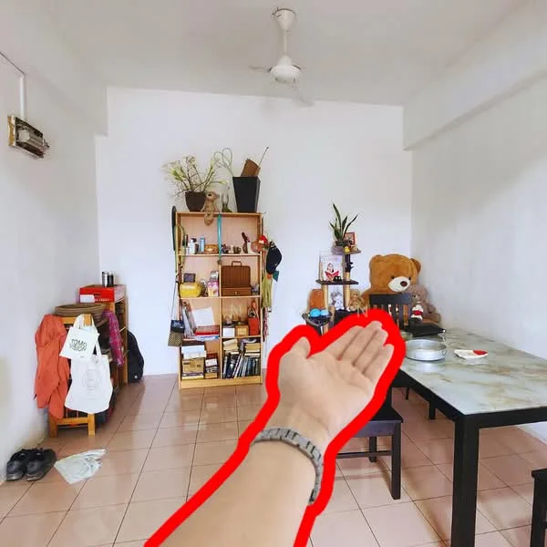 Living features: white painted walls, tile flooring, 5-blade ceiling fan, wall-mounted split AC, wooden shelving unit, decorative plants, stuffed bear, dining table, black dining chairs, open shelving with books, area rug, clothing on chair; style: minimalist.