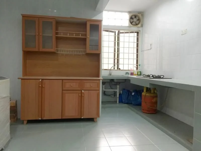 Kitchen features: light grey tiled flooring, white tiled walls, wooden cabinetry with glass-front upper cabinets, countertop with sink, single-bowl stainless-steel sink, chrome faucet, gas stove with two burners, exhaust fan, window with grid pattern, open shelving above countertop, storage cabinet with drawers, blue plastic bags visible; style: modern.
