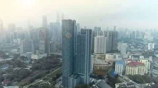 Exterior type: high-rise condominium; features: glass curtain wall, approximately 30-storey high-rise, surrounded by urban landscape, city skyline view, adjacent to other high-rise buildings, visible green spaces, mixed-use development in the vicinity; style: modern.