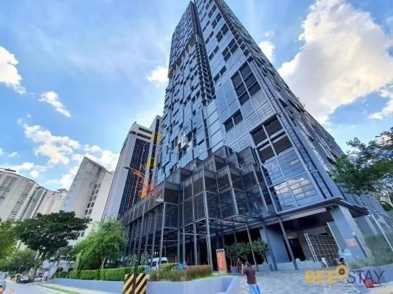 Exterior type: high-rise condominium; features: glass curtain wall, exposed concrete facade, recessed balconies, vertical fins, feature lighting at night, manicured lawn, mature trees, stone-paved walkway; style: modern.