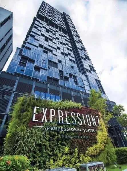 Exterior type: high-rise condominium; features: glass curtain wall facade, green wall with plants, prominent signage, modern architectural design, multiple balconies, surrounded by greenery, urban context, approximately 20-storey high-rise; style: modern.