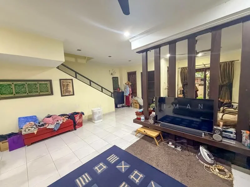 Living features: white painted walls, ceramic tile flooring, ceiling fan, wall-mounted TV, wooden staircase, area rug with geometric pattern, sofa in red, decorative wall art, curtains, coffee table.