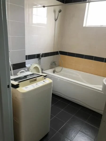 Bathroom features: bathtub, shower head with handheld option, white tiled walls, black tiled accent strip, cream tiled accent wall, dark grey floor tiles, washing machine, window for natural light.