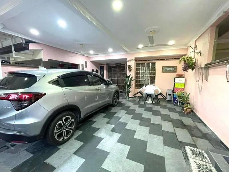 Room features: grey and black patterned floor tiles, pink painted walls, ceiling fan, wooden door, window with grille, indoor plants, table and chairs, car parked inside; style: modern.