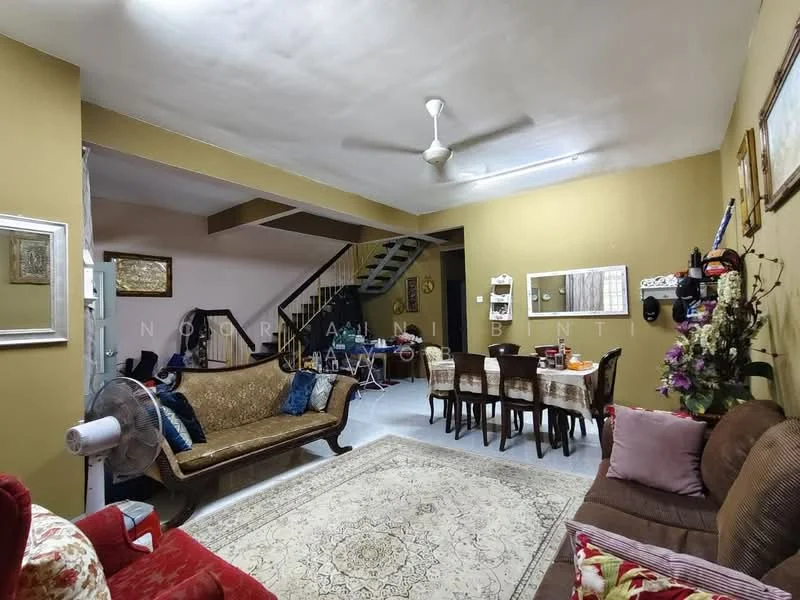 Living features: cream painted walls, white ceiling, 5-blade ceiling fan, sofa with red upholstery, 3-seater fabric sofa in brown, wooden coffee table, area rug with intricate pattern, decorative wall art, dining table with 6 chairs, wooden sideboard, flooring with white tiles, staircase with wooden railing; style: traditional.