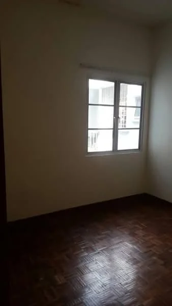 Room features: wooden flooring, white painted walls, single window, natural light, no visible furniture.