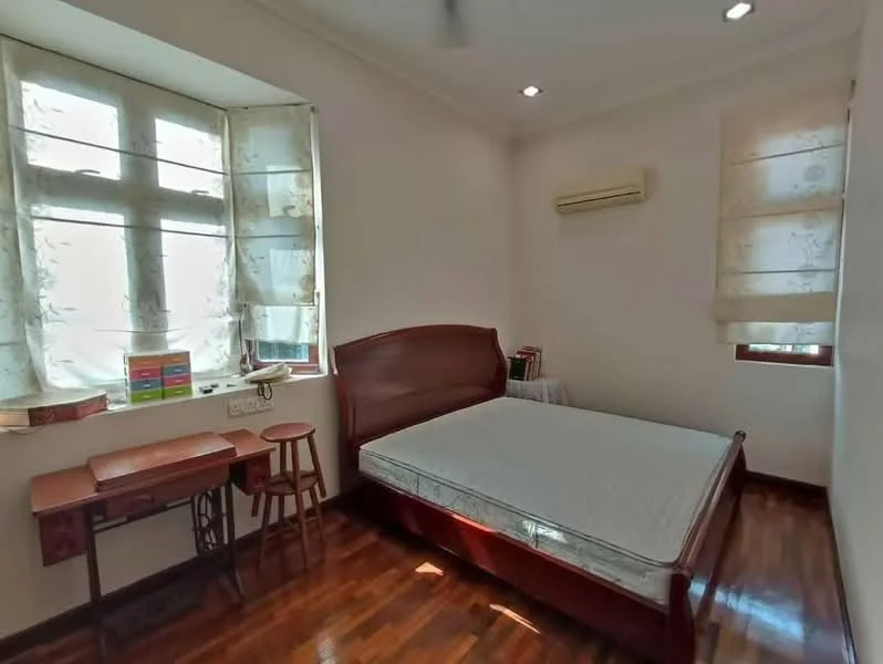 Bedroom features: wooden flooring, white painted walls, ceiling fan, single bed frame, window with sheer curtains, air conditioning unit, small desk, stool, decorative items on window sill; style: minimalist.