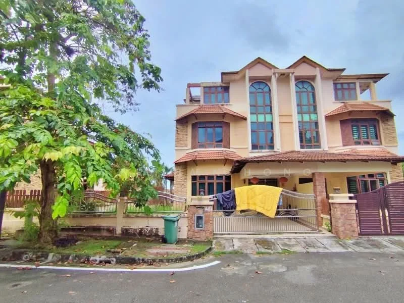 Exterior type: semi-detached house; features: two-storey structure, stone cladding on lower level, cream painted facade, red tiled roof, arched windows, balconies with decorative railings, manicured lawn, driveway with interlocking pavers, fenced front yard, visible garbage bin, surrounded by greenery; style: modern.