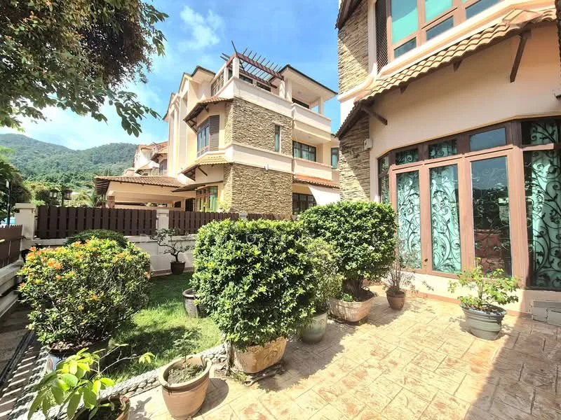 Exterior type: detached bungalow; features: stone cladding on facade, terracotta roof tiles, manicured lawn, landscaped garden with shrubs, potted plants, fenced yard, outdoor seating area, mountain view in background; style: modern.