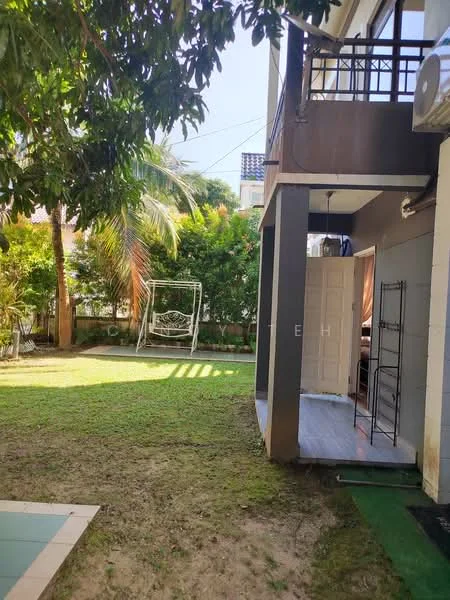Exterior type: detached bungalow; features: manicured lawn, swing seat, palm trees, greenery, exterior wall with grey paint, sliding glass door, outdoor space, patio area; style: modern.