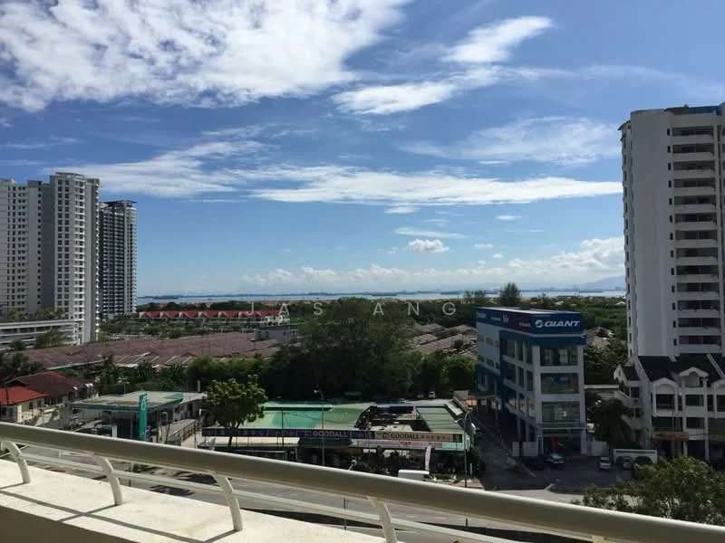 Exterior type: high-rise condominium; features: city skyline view, surrounded by greenery, adjacent to commercial buildings, clear blue sky, water view in the distance; style: modern.