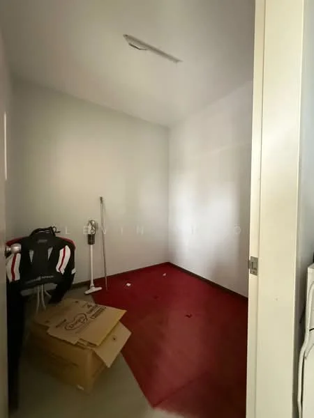 Room features: white painted walls, red vinyl flooring, ceiling light, corner with vacuum cleaner, cardboard boxes on floor.
