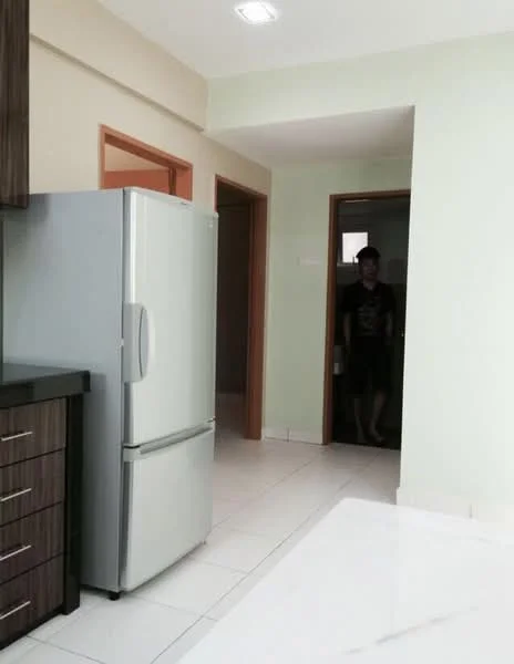 Kitchen features: stainless-steel fridge, black countertop, wood cabinetry, white tiled flooring, light green painted walls, recessed ceiling lights, open layout to hallway, doorway leading to another room; style: modern. Room features: doorway, light green painted walls, white tiled flooring.