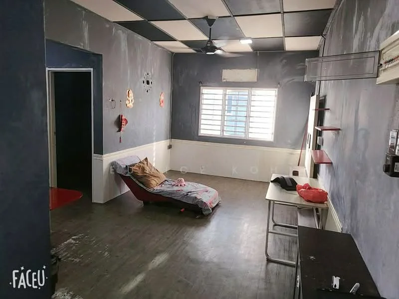 Living features: grey painted walls, black and white checkered ceiling, laminate flooring, 1 ceiling fan, window with horizontal bars, small table, sofa bed, wall-mounted shelf, decorative wall art, light switch panel.