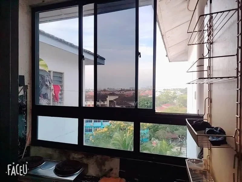 Room features: large window with multiple panes, city view, sill with potted plants, metal shelving unit, dark wall, light-colored ceiling, visible outdoor landscape, partially obscured view of neighboring buildings; view: city.