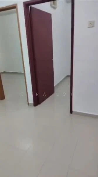 Room features: white painted walls, light-colored tile flooring, wooden door, door frame, neutral color scheme, no visible furniture, single light switch, no visible windows.