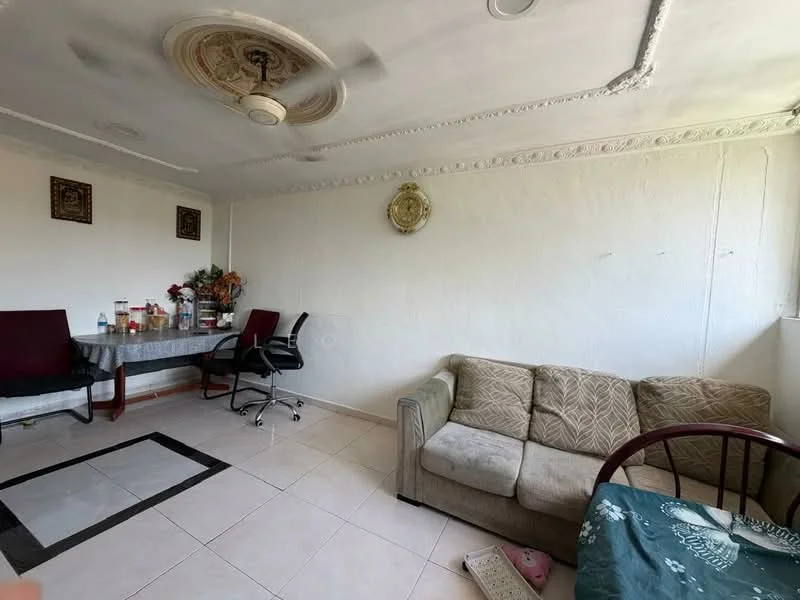 Living features: cream painted walls, tile flooring, tray ceiling with decorative medallion, 5-blade ceiling fan, sofa in beige fabric, wooden chair, glass dining table, 2 dining chairs, decorative wall clock, houseplants in ceramic pots; style: modern.