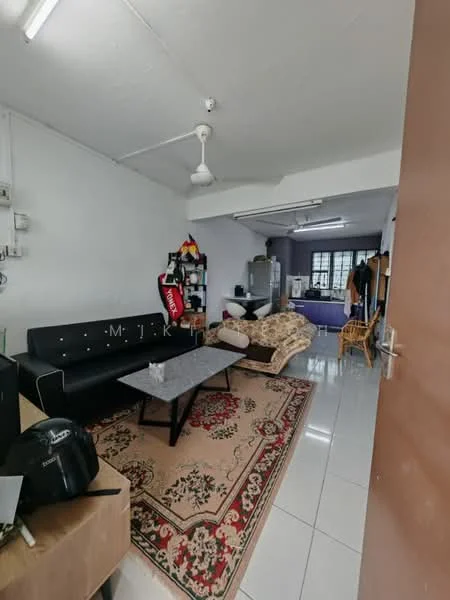 Living features: black leather sofa, 3-seater sofa, coffee table with marble top, area rug with floral pattern, white painted walls, ceiling fan, tile flooring, window with natural light, decorative wall art; style: modern. Kitchen features: white cabinetry, stainless-steel fridge, kitchen countertop, open layout to living area; style: modern.