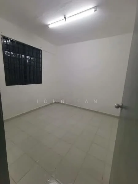 Room features: white painted walls, tile flooring, single light fixture on ceiling, black window grills, window with no treatments, plain door, neutral color scheme; style: minimalist.