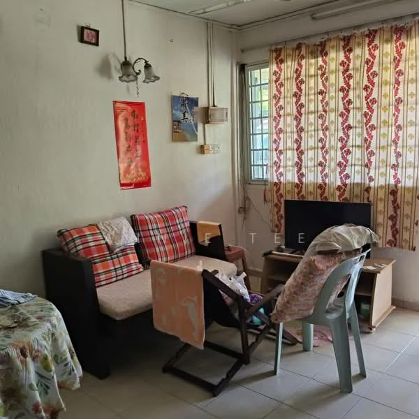 Living features: plaid fabric sofa, wooden coffee table, TV console, wall-mounted TV, curtains with floral pattern, white painted walls, tiled flooring, ceiling light fixture, decorative wall art, folding chair, laundry drying rack.