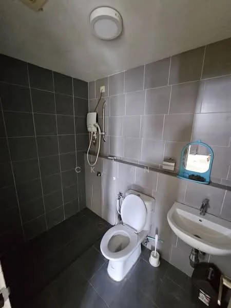 Bathroom features: grey tiled walls, dark grey tiled flooring, one-piece toilet, wall-mounted shower head, handheld shower, sink with wall-mounted faucet, mirror, toilet brush holder, soap dispenser; style: modern.