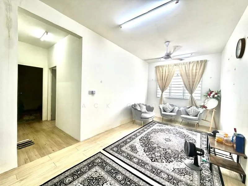 Living features: white painted walls, laminate flooring, 5-blade ceiling fan, large window with sheer curtains, area rug with geometric pattern, two armchairs in grey fabric, decorative mirror, wall clock, small table with decorative items; style: minimalist. Room features: white painted walls, laminate flooring, doorway leading to hallway.