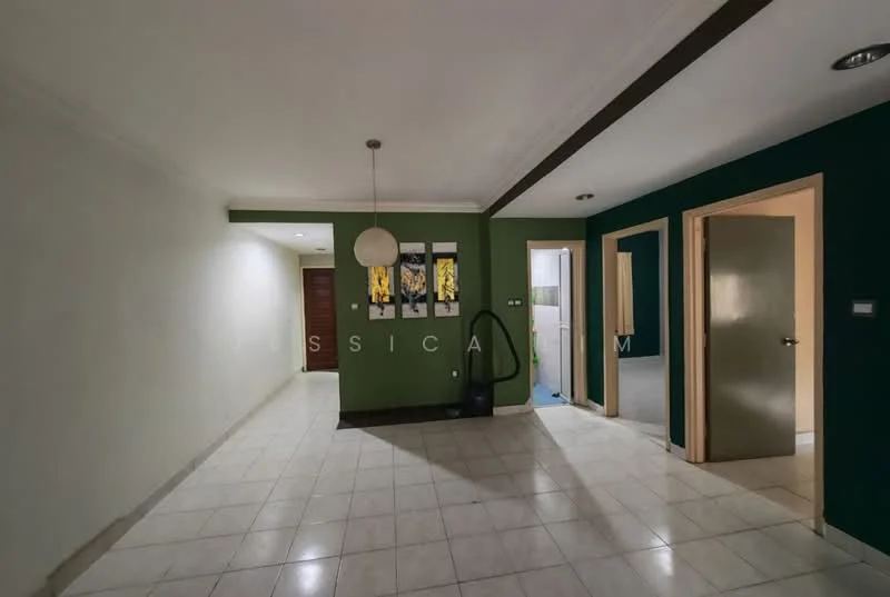 Room features: white painted walls, green accent wall, tile flooring, ceiling light fixture, doorway leading to another room, vacuum cleaner visible, baseboards, crown moulding; style: modern.