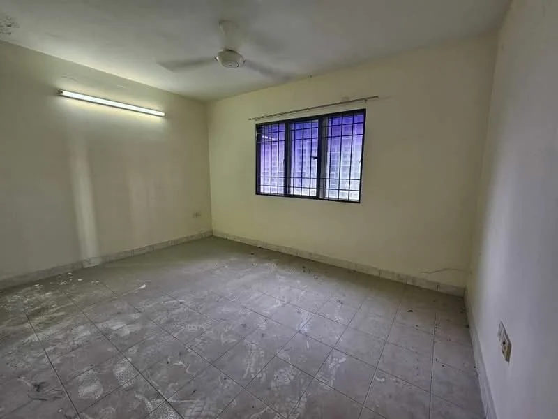 Room features: plain white walls, tiled flooring, ceiling fan, single window with metal grille, neutral color scheme, no visible furniture, light fixture on ceiling, corner location; style: minimalist.