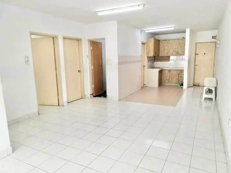 Room features: white painted walls, glossy white tile flooring, fluorescent ceiling lights, open layout, kitchen area visible, wood cabinetry in kitchen, light-colored countertops, multiple doorways, no visible appliances, neutral color scheme; style: modern.