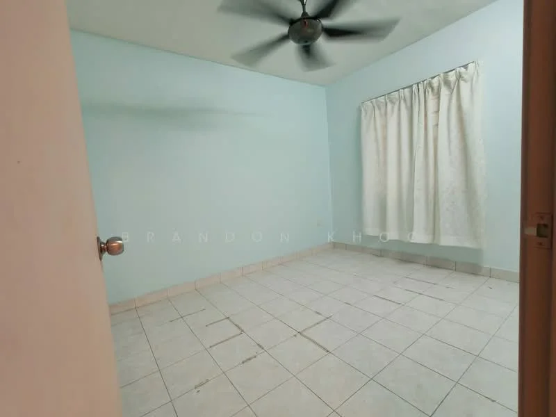 Room features: light blue painted walls, white curtains, tiled flooring, ceiling fan, single window, no visible furniture, empty room.