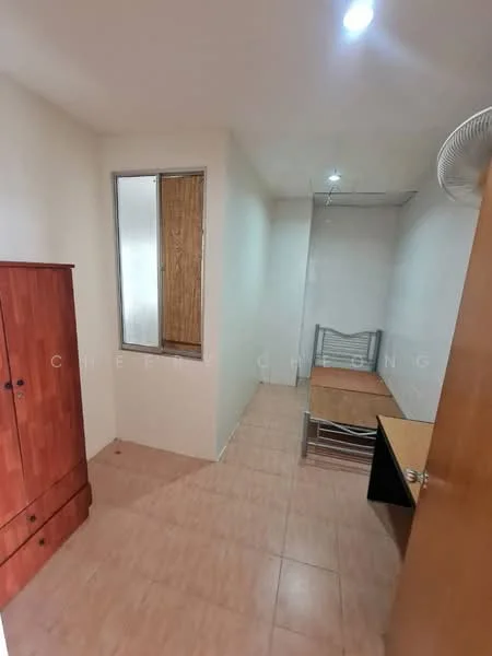 Room features: light-colored painted walls, tile flooring, single window with wooden frame, wooden wardrobe with drawers, metal bed frame with mattress, small desk, ceiling fan, LED ceiling lights; style: minimalist.