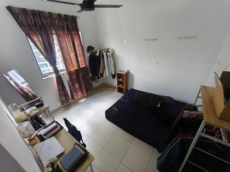 Bedroom features: white painted walls, tile flooring, 5-blade ceiling fan, floor-to-ceiling windows, curtains with floral pattern, built-in wardrobe, mirror, study desk, bed with dark bedding, clothing rack, bookshelf.