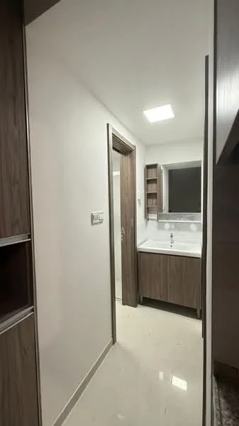 Laundry features: white painted walls, glossy tile flooring, wood cabinetry, single-bowl sink, chrome faucet, built-in shelves, flush ceiling light, mirror above sink; style: modern.
