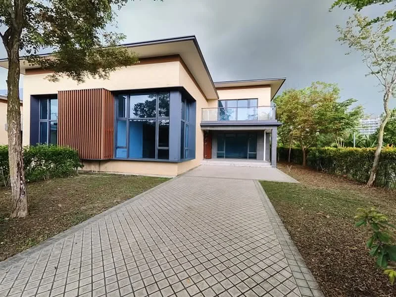 Exterior type: detached bungalow; features: cream painted facade, wood cladding accent, flat roof, approximately 2-storey, manicured lawn, mature trees, paved walkway, large windows, covered porch, surrounded by greenery; style: modern.