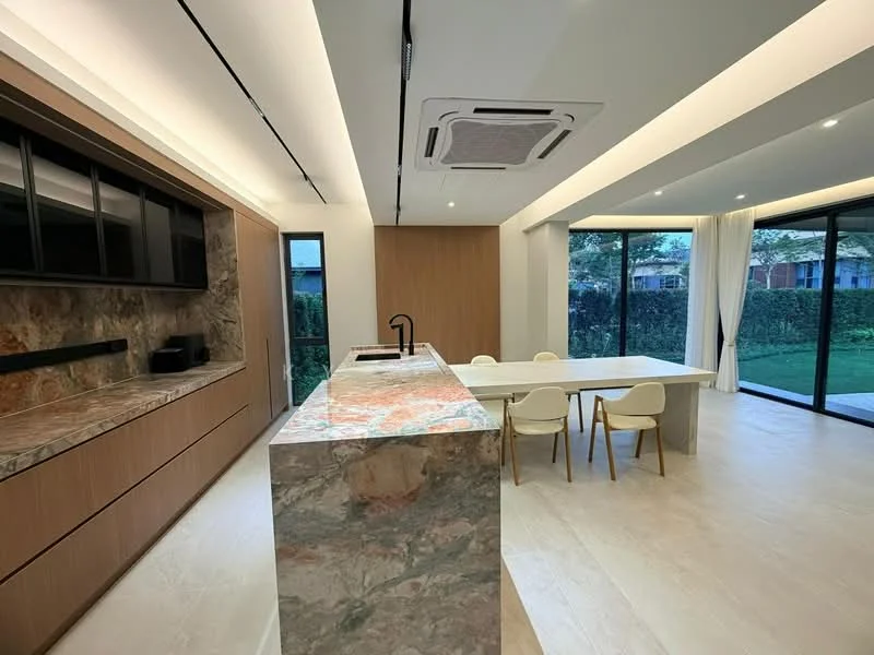 Kitchen features: marble countertop with unique pattern, wood cabinetry with flat-panel design, built-in oven, microwave, stainless-steel sink, chrome pull-down faucet, open shelving, recessed LED downlights, floor-to-ceiling windows, dining table with white surface, upholstered dining chairs, air conditioning unit, light wood flooring; style: modern; view: garden.