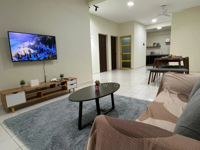 Living features: 3-seater fabric sofa in beige, coffee table with black surface, area rug with geometric pattern in grey, wall-mounted TV, TV console in wood, ceiling fan, white painted walls, tile flooring, decorative plant on coffee table; style: modern. Dining features: 4-seater dining table, wooden dining chairs, white painted walls, tile flooring; style: modern. Kitchen features: kitchen cabinetry in wood, white walls, tile flooring, open layout to living area; style: modern.
