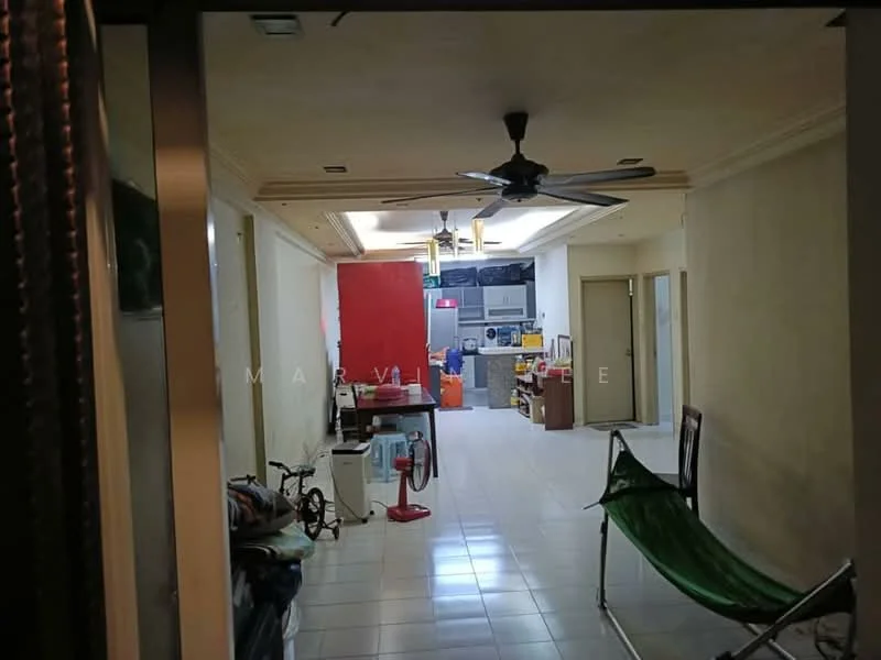 Room features: white painted walls, tile flooring, tray ceiling, recessed downlights, 5-blade ceiling fan, open layout, kitchen area visible, laundry area visible, bicycle, green folding chair, various appliances visible.