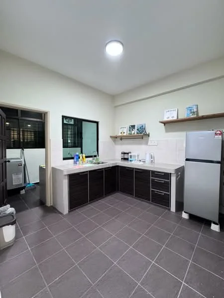 Kitchen features: L-shaped kitchen layout, dark wood cabinetry, light-colored countertop, stainless-steel fridge, built-in oven, ceramic tile flooring, single-bowl stainless-steel sink, chrome pull-down faucet, open shelving, wall-mounted storage, window for natural light, recessed ceiling light; style: modern.