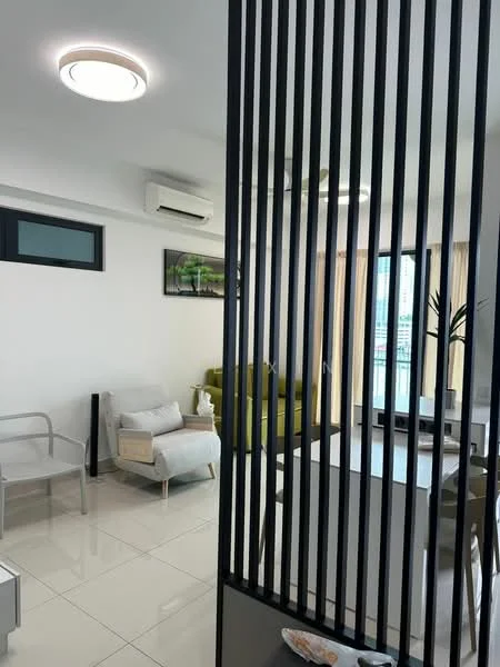Living features: white painted walls, glossy tile flooring, recessed ceiling lights, 5-blade ceiling fan, floor-to-ceiling windows, sheer curtains, green sofa, light grey armchair, decorative plant, wall-mounted artwork, coffee table, TV console; style: modern; view: city. Room features: black vertical slatted partition, air conditioning unit.