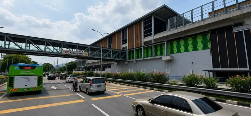 Exterior features: multi-storey building, glass facade, green accent panels, overhead pedestrian bridge, roadway in front, landscaped area with shrubs, visible traffic, urban setting; style: modern.