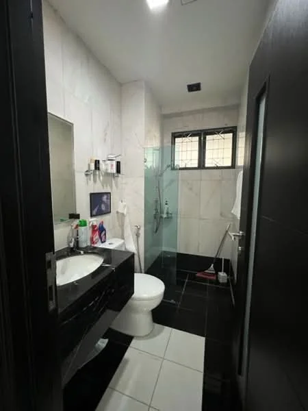 Bathroom features: white ceramic toilet, single-sink vanity with black countertop, mirror above vanity, glass shower enclosure, rain shower head, handheld shower, white tiled walls, black tiled flooring, towel rack, window with grid pattern, shelf with toiletries; style: modern.
