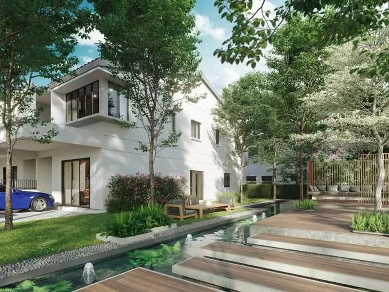 Exterior type: detached bungalow; features: white painted facade, flat roof, landscaped garden with manicured lawn, mature trees, stone-paved walkway, wooden deck, water feature with stepping stones, outdoor seating area, car parked in driveway, fenced garden area; style: modern.