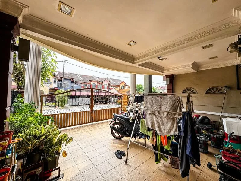 Room features: tiled flooring, ceiling with decorative moulding, clothes drying rack, motorcycle, potted plants, laundry hanging on line, fence with gate, outdoor view of houses, overhead lighting fixtures; view: garden.